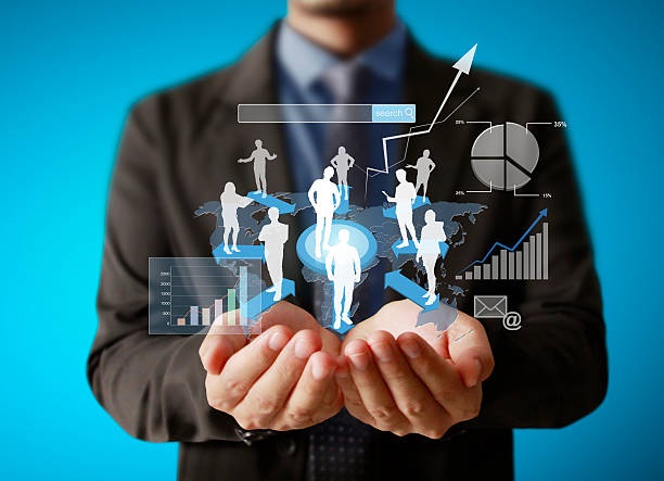 Businessman with financial symbols coming